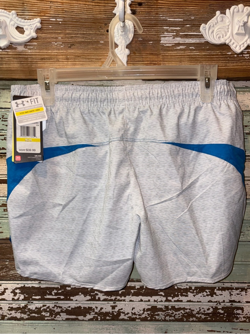 NEW Under Armour women’s Heather Gray Athletic Shorts with Blue Trim